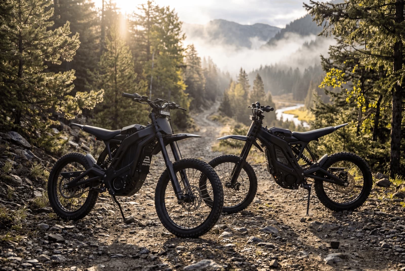 Two electric dirt bikes parked on a mountain trail